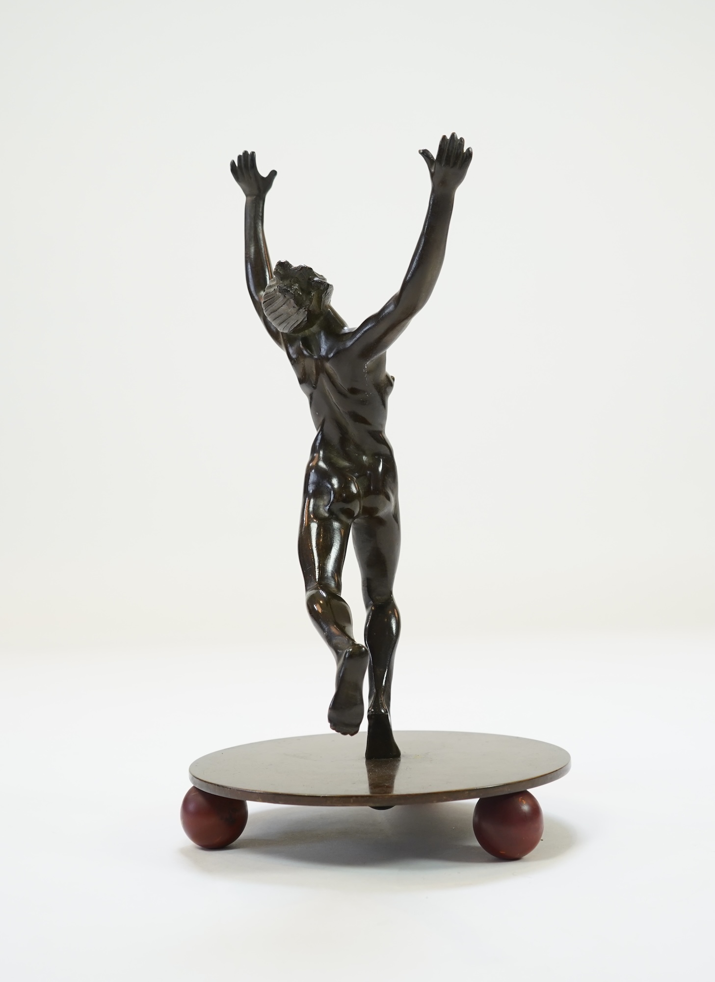 An Art Deco Austrian patinated bronze of a nude female dancer in the manner of Otto Hafenrichter